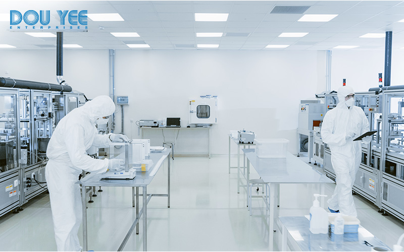 A cleanroom with scientists working inside.