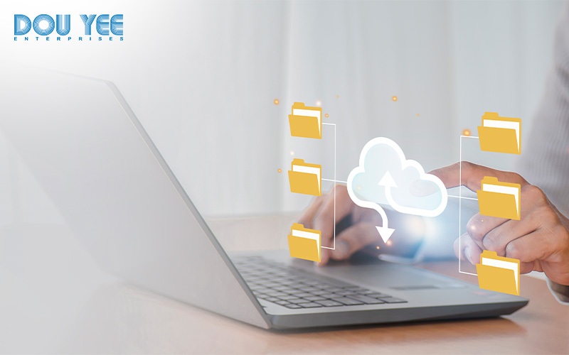 A person using a laptop to access cloud files.