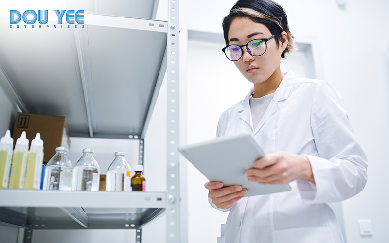 Lab worker using a tablet for quality management.