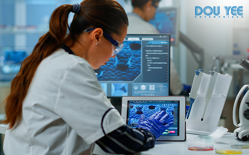 Scientist using a tablet for lab data management.